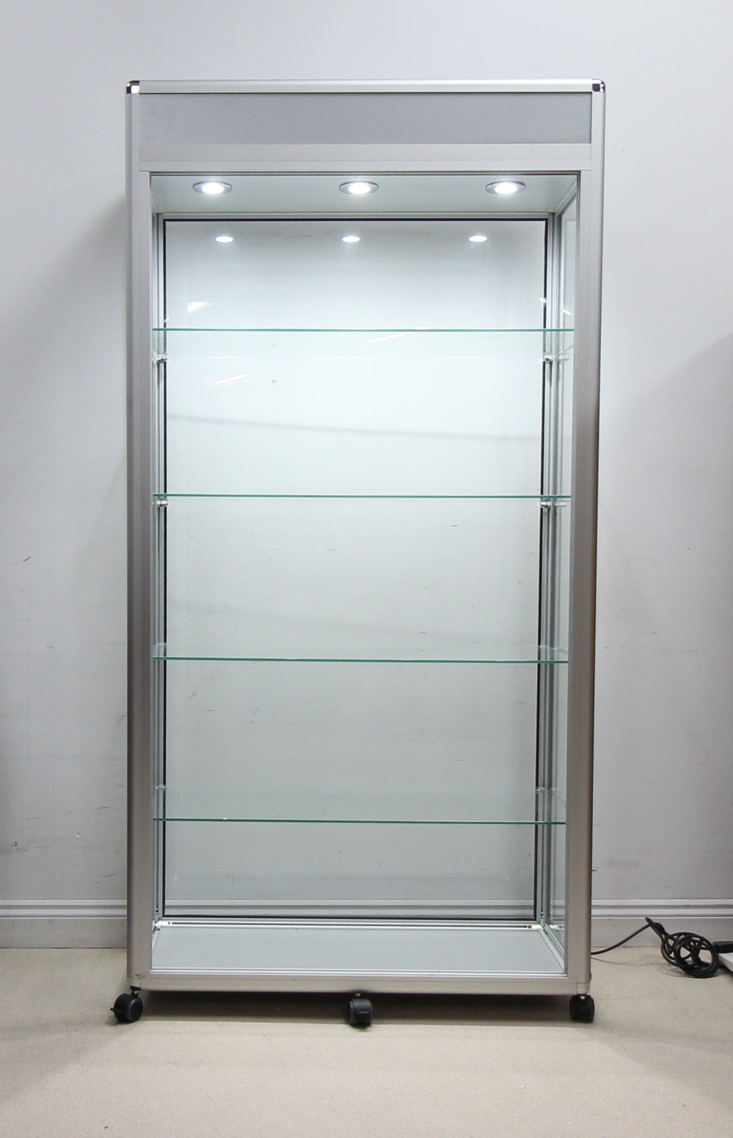 A Spacious Glass Display Cabinet For Shop or Showroom -Free Standing with Lights